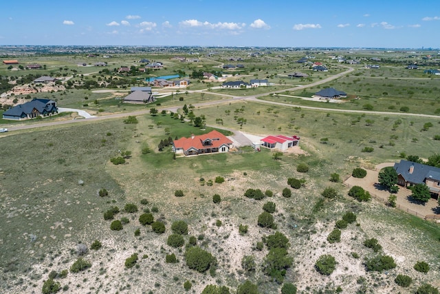 birds eye view of property featuring a rural view