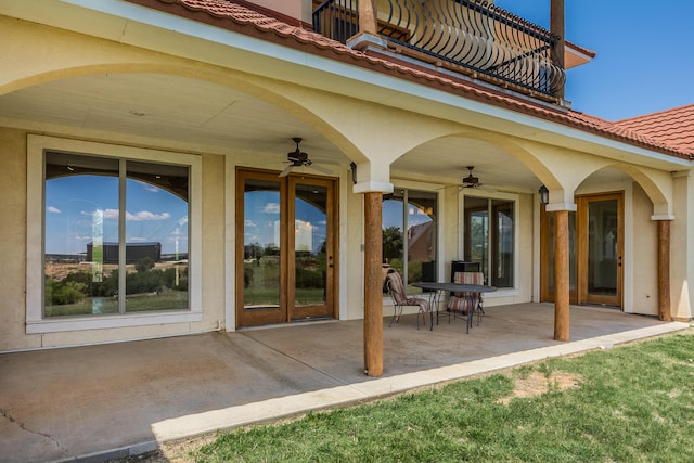 view of patio / terrace featuring a balcony and ceiling fan