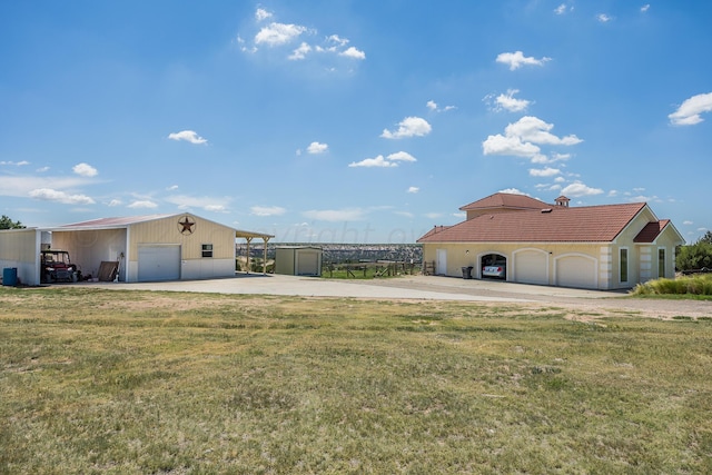 exterior space with an outbuilding, a garage, and a carport