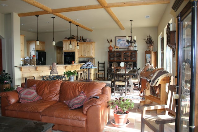 living room featuring beamed ceiling