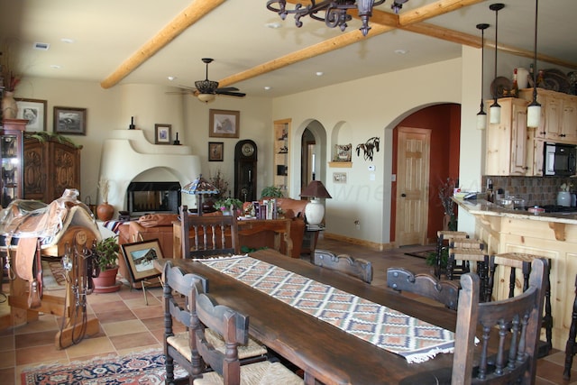 dining area with ceiling fan and light tile patterned flooring