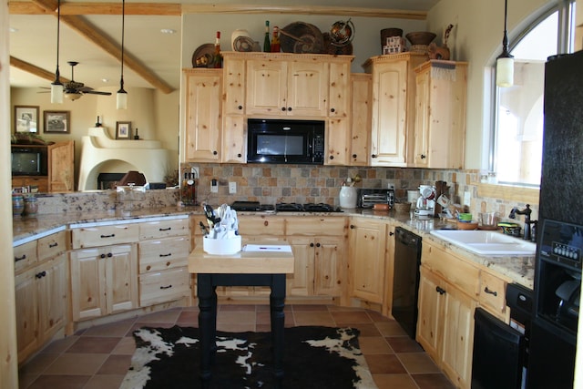 kitchen with pendant lighting, black appliances, sink, light brown cabinetry, and tasteful backsplash