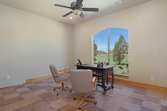 interior space featuring tile patterned floors and ceiling fan