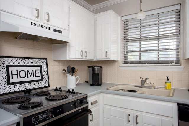 5701 Durrett Pl, Amarillo, TX 79109 - kitchen with range with electric cooktop, under cabinet range hood, light countertops, tasteful backsplash, and white cabinetry