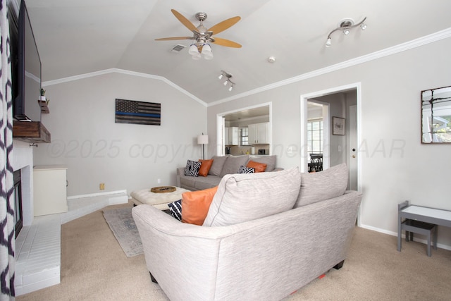 5701 Durrett Pl, Amarillo, TX 79109 - living room featuring a ceiling fan, crown molding, light colored carpet, and vaulted ceiling