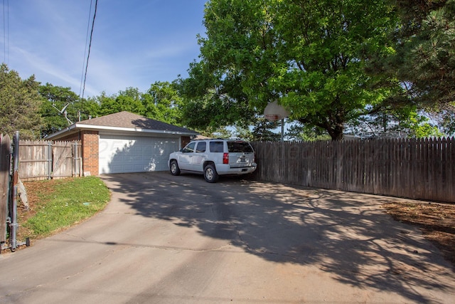 5701 Durrett Pl, Amarillo, TX 79109 - view of property exterior featuring a garage and brick siding