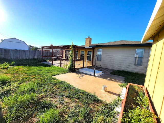 view of yard with a fenced backyard, a patio, and a vegetable garden