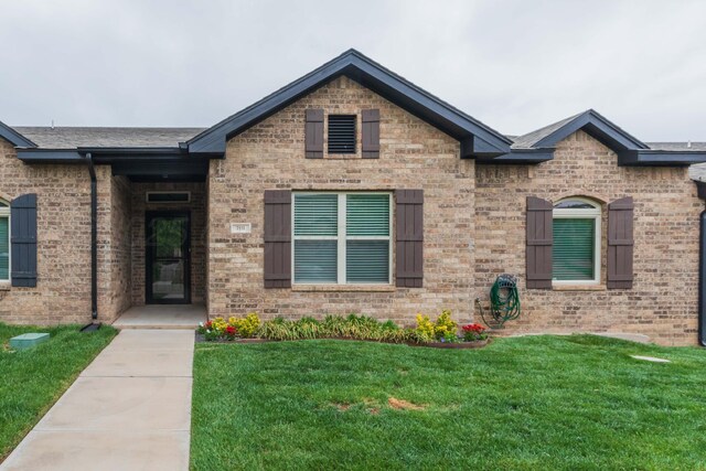 7111 Mosley St, Amarillo, TX 79119 - view of front of house featuring a front lawn and brick siding