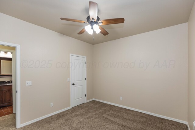 7111 Mosley St, Amarillo, TX 79119 - unfurnished room featuring baseboards, a ceiling fan, carpet, and a sink