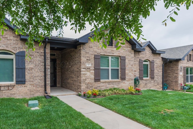 7111 Mosley St, Amarillo, TX 79119 - exterior space featuring brick siding and a yard