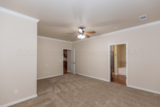 7111 Mosley St, Amarillo, TX 79119 - unfurnished bedroom featuring crown molding, carpet flooring, connected bathroom, baseboards, and visible vents