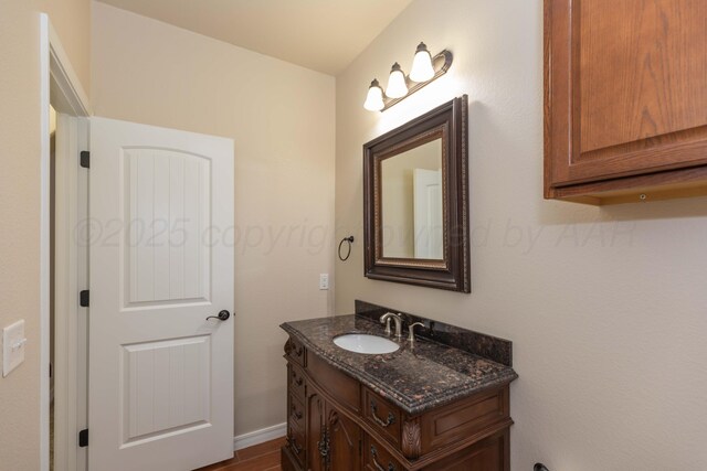 7111 Mosley St, Amarillo, TX 79119 - bathroom featuring vanity and wood finished floors