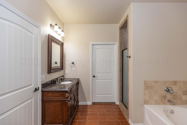 7111 Mosley St, Amarillo, TX 79119 - full bath featuring a garden tub, baseboards, a shower with shower door, and vanity
