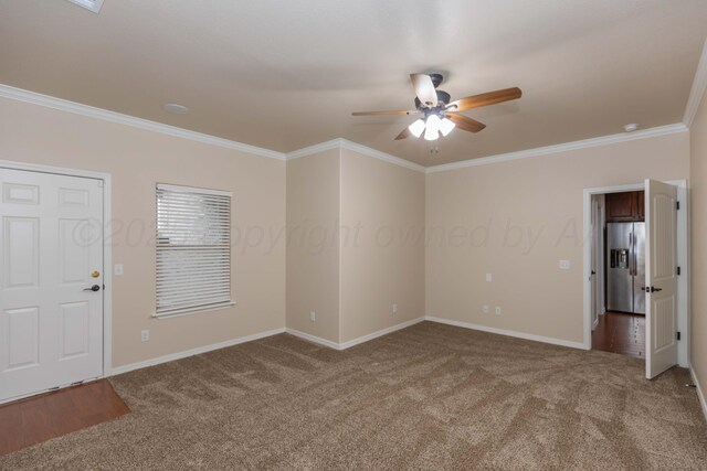 7111 Mosley St, Amarillo, TX 79119 - spare room featuring crown molding, ceiling fan, light colored carpet, and baseboards