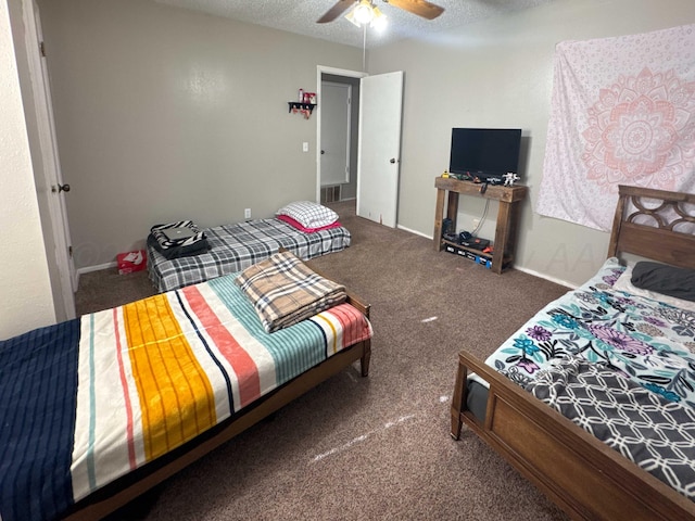 carpeted bedroom with a textured ceiling and ceiling fan