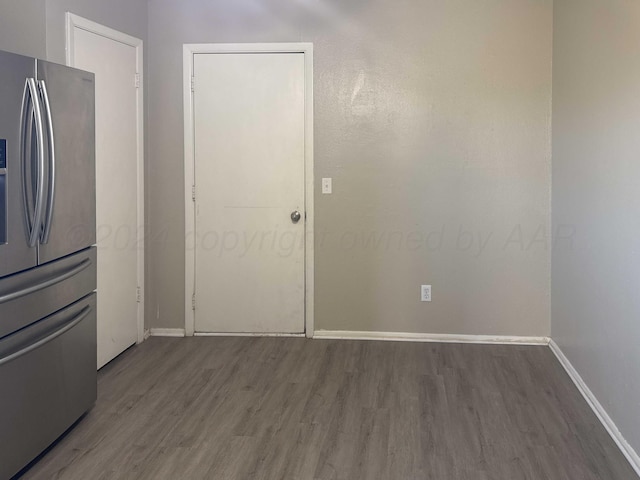 kitchen featuring stainless steel fridge with ice dispenser and wood-type flooring