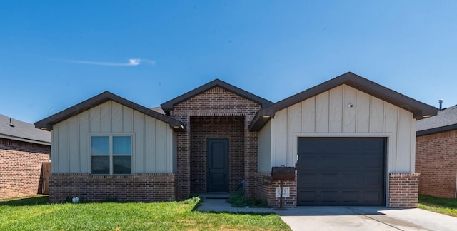 view of front of house with a garage and a front yard