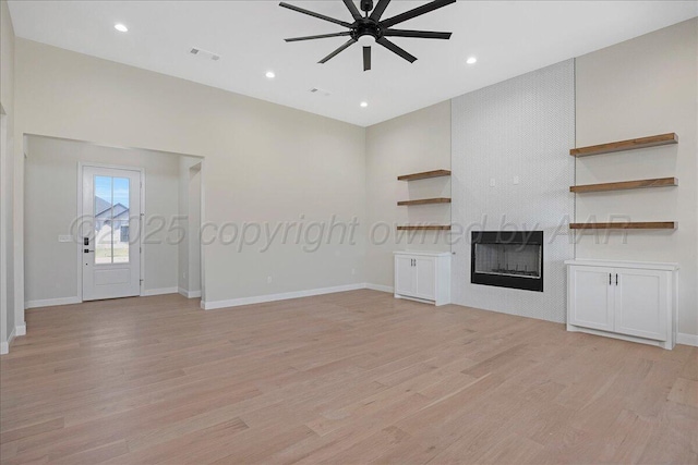 5805 Sheridan St, Amarillo, TX 79119 - unfurnished living room featuring ceiling fan, light wood finished floors, a fireplace, baseboards, and recessed lighting