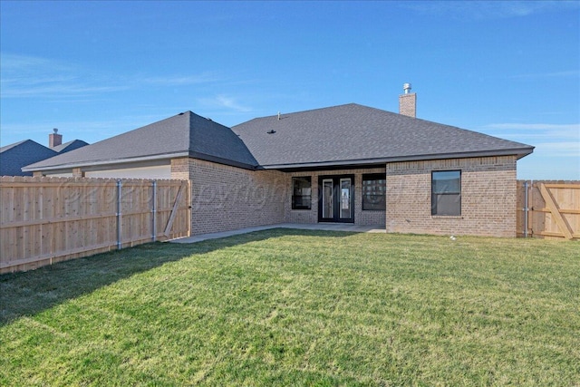 5805 Sheridan St, Amarillo, TX 79119 - back of property featuring brick siding, a chimney, and roof with shingles