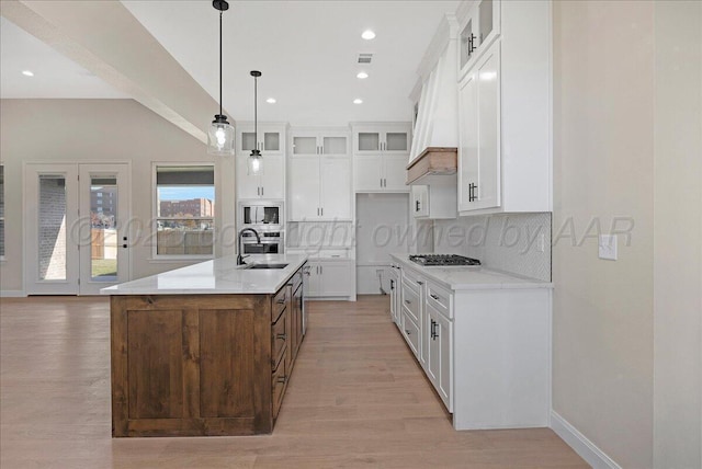 5805 Sheridan St, Amarillo, TX 79119 - kitchen featuring built in microwave, light wood-style flooring, decorative backsplash, a sink, and recessed lighting