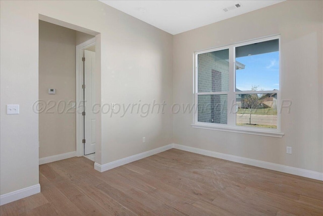 5805 Sheridan St, Amarillo, TX 79119 - empty room with light wood-style floors and baseboards