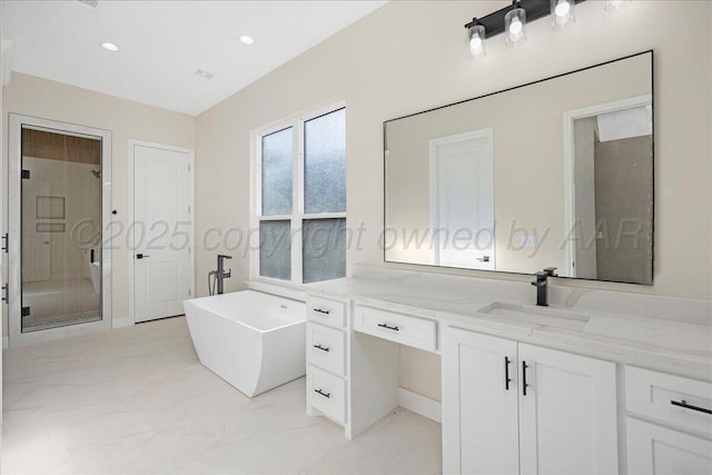 5805 Sheridan St, Amarillo, TX 79119 - bathroom featuring a shower stall, marble look tiles, a freestanding bath, vanity, and recessed lighting