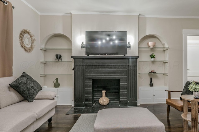 505 S Belleview St, Amarillo, TX 79106 - living room featuring dark wood-type flooring, crown molding, built in shelves, and a fireplace with flush hearth