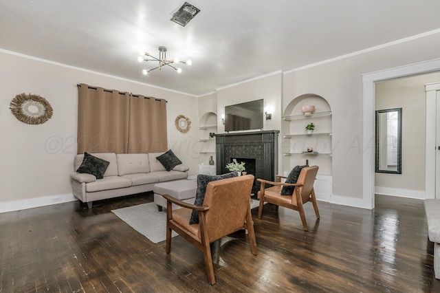 505 S Belleview St, Amarillo, TX 79106 - living area featuring hardwood / wood-style floors, built in features, crown molding, a chandelier, and a brick fireplace