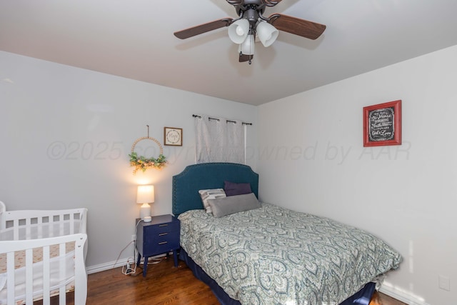 bedroom with wood finished floors, baseboards, and a ceiling fan