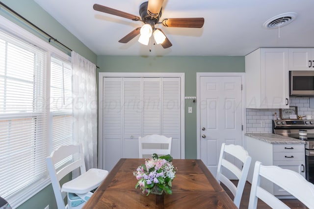 dining room featuring ceiling fan