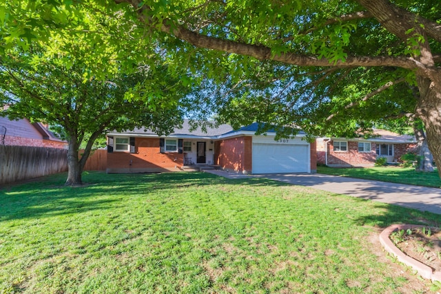 view of front of house featuring brick siding, a garage, and driveway