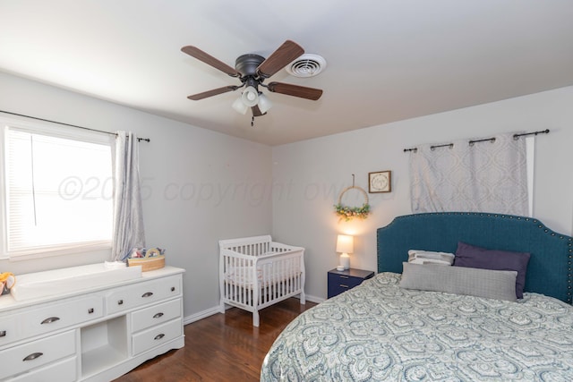 bedroom featuring dark wood-style floors, baseboards, and ceiling fan