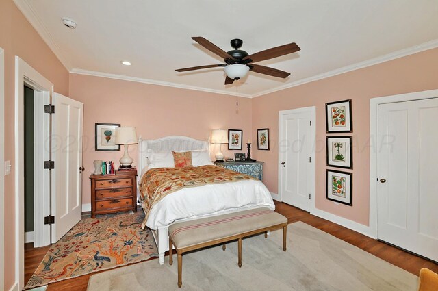 2215 S Hughes St, Amarillo, TX 79109 - bedroom with crown molding, wood finished floors, baseboards, and ceiling fan