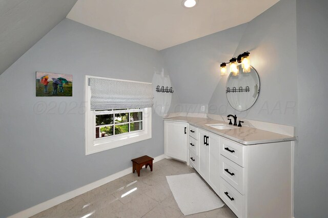 2215 S Hughes St, Amarillo, TX 79109 - bathroom with vaulted ceiling, baseboards, marble finish floors, vanity, and recessed lighting