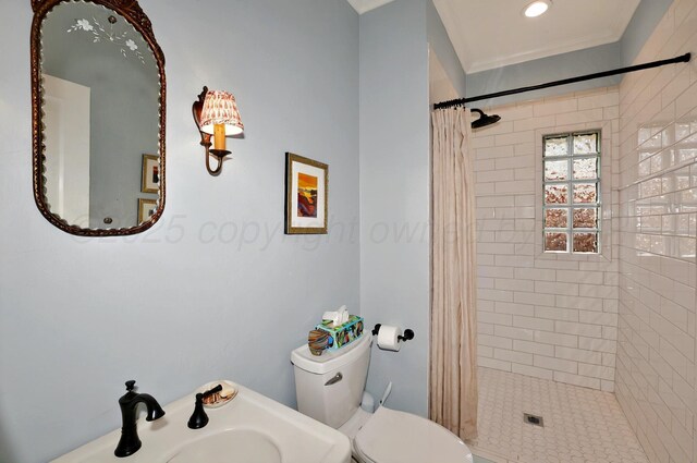2215 S Hughes St, Amarillo, TX 79109 - full bath with a stall shower, toilet, a sink, and ornamental molding