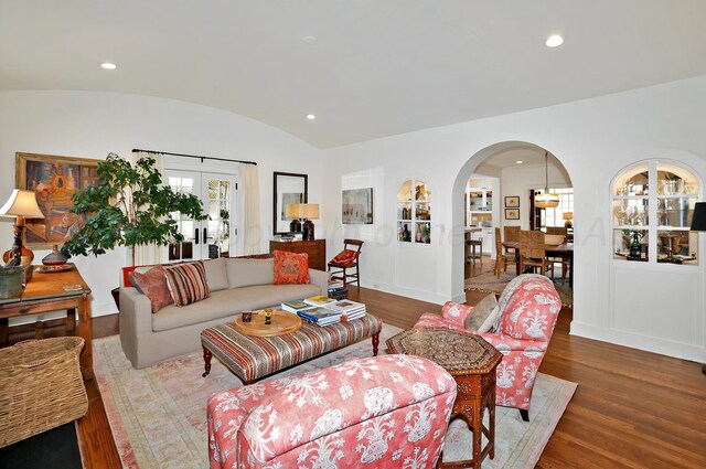 2215 S Hughes St, Amarillo, TX 79109 - living area with wood finished floors, arched walkways, vaulted ceiling, recessed lighting, and french doors