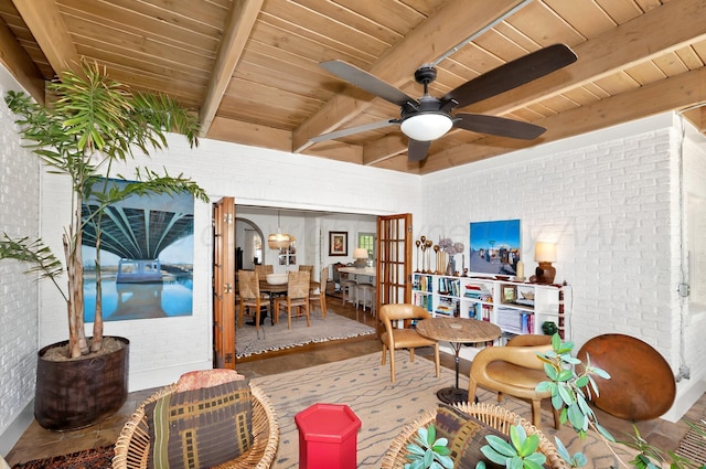 2215 S Hughes St, Amarillo, TX 79109 - sitting room featuring wood ceiling, beam ceiling, brick wall, a ceiling fan, and wood finished floors