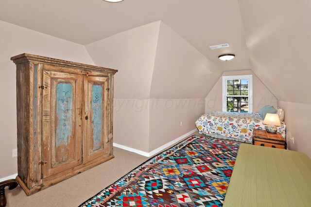 2215 S Hughes St, Amarillo, TX 79109 - carpeted bedroom with lofted ceiling and baseboards