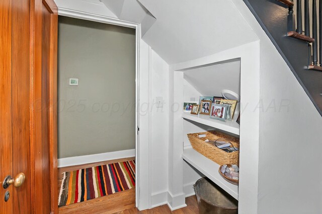 2215 S Hughes St, Amarillo, TX 79109 - corridor with wood finished floors, vaulted ceiling, and baseboards