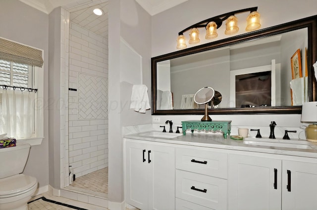 2215 S Hughes St, Amarillo, TX 79109 - full bath featuring toilet, tiled shower, double vanity, baseboards, and ornamental molding