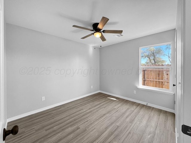 unfurnished room featuring ceiling fan and light hardwood / wood-style floors