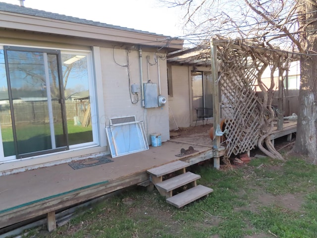 view of property exterior with a wooden deck