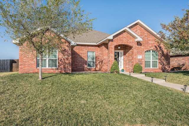 view of front of property with a front lawn