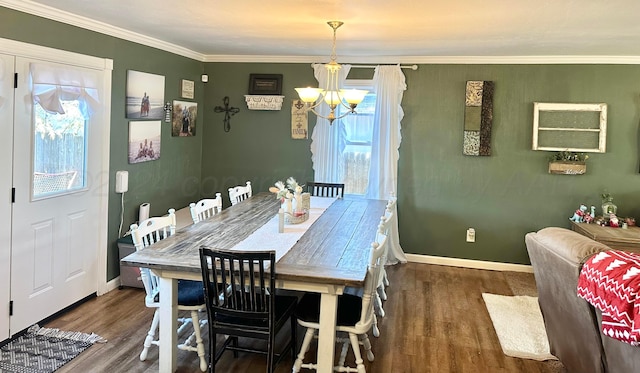 dining room featuring a chandelier, dark hardwood / wood-style flooring, and a healthy amount of sunlight