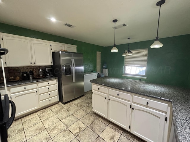 7810 Farrell Dr, Amarillo, TX 79121 - kitchen with stainless steel refrigerator with ice dispenser, white cabinets, pendant lighting, backsplash, and light tile patterned floors