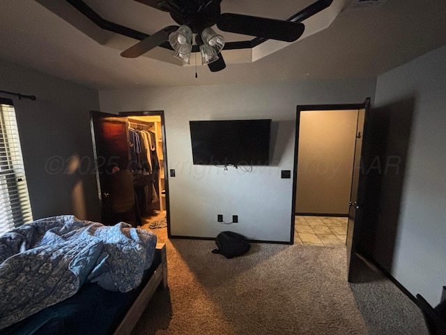 7810 Farrell Dr, Amarillo, TX 79121 - carpeted bedroom featuring a walk in closet and ceiling fan