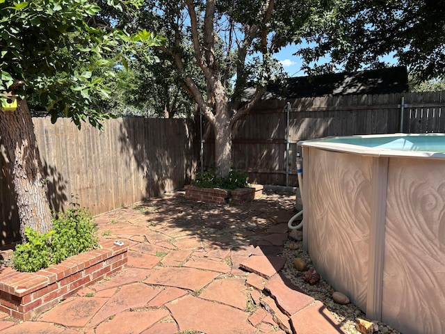 7810 Farrell Dr, Amarillo, TX 79121 - fenced backyard featuring a patio area