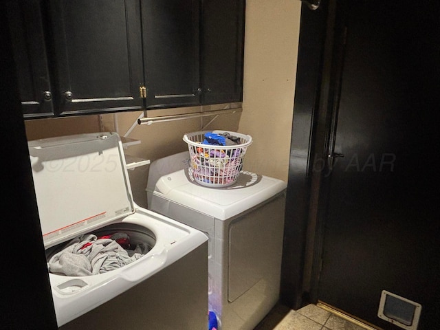 7810 Farrell Dr, Amarillo, TX 79121 - washroom with washer and dryer, cabinet space, and light tile patterned floors