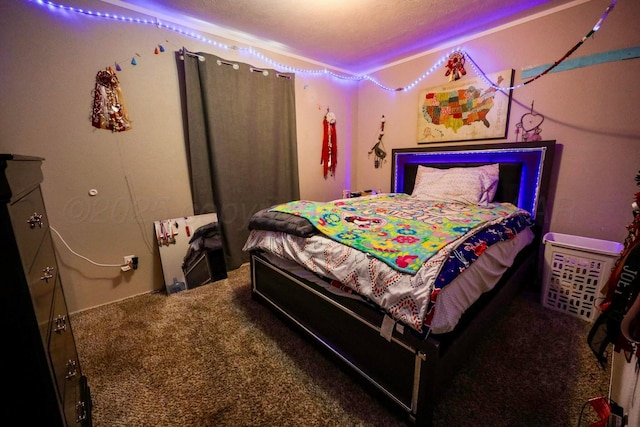 carpeted bedroom with a textured ceiling