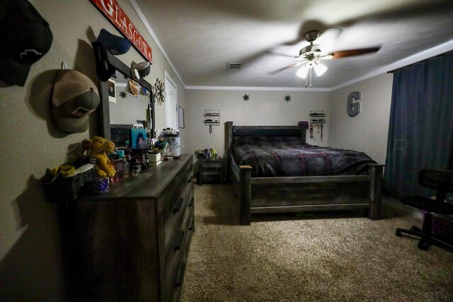 bedroom with carpet, visible vents, and crown molding